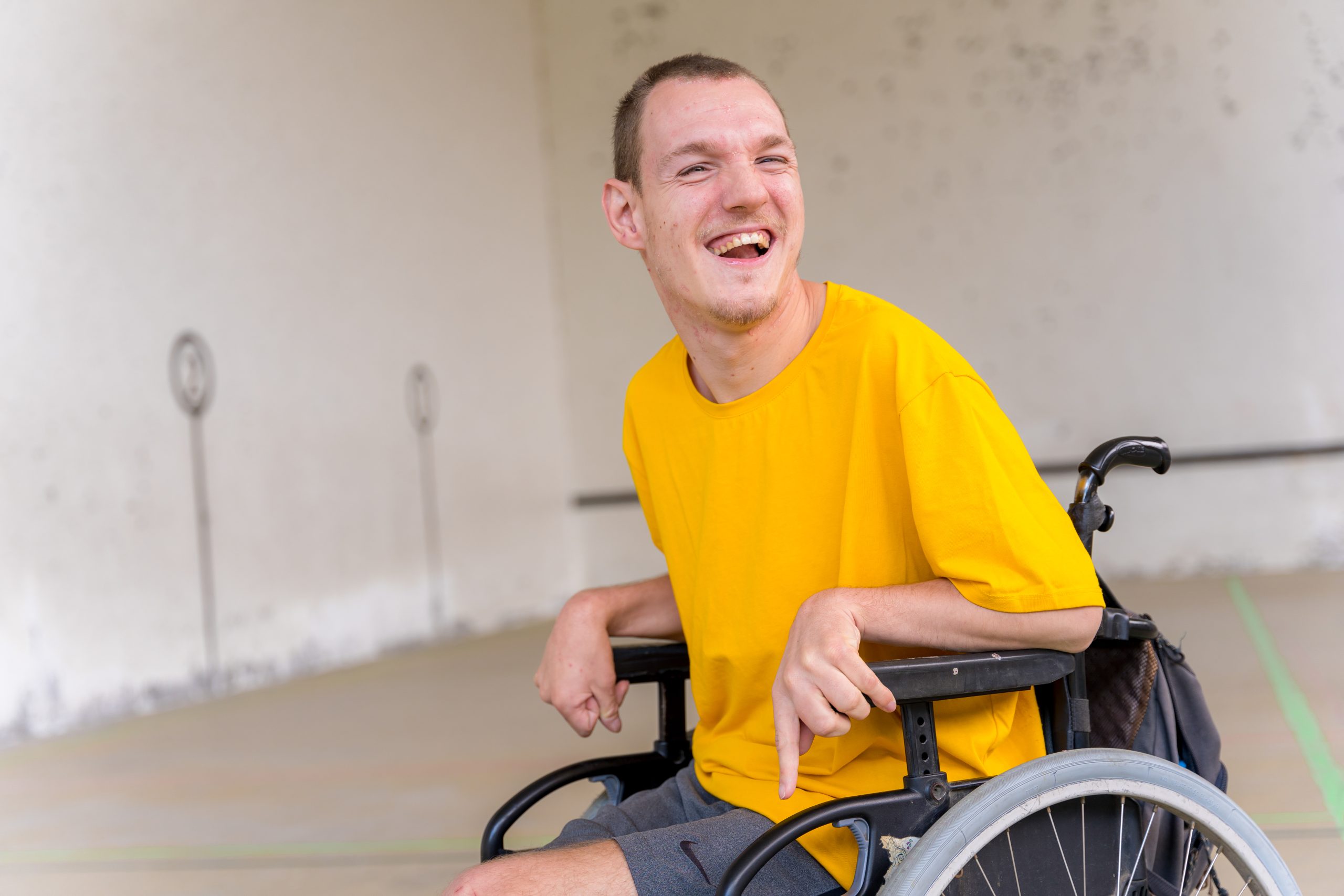 Portrait of a disabled person in a wheelchair at a Basque pelota game ...